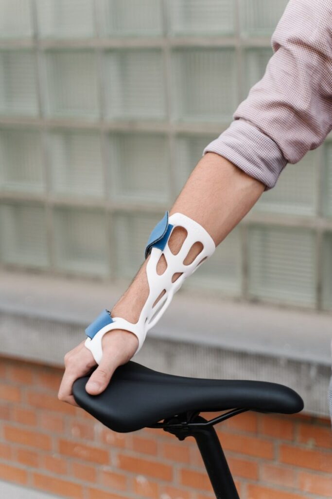 Custom-fit 3D printed wrist and forearm support worn on an arm