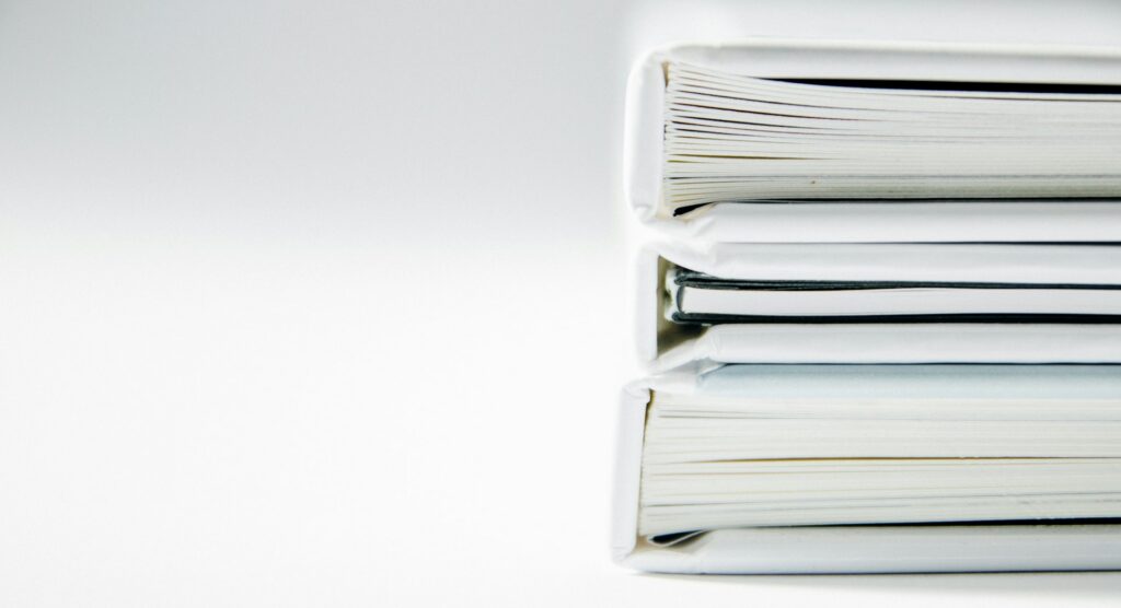 Stack of document binders ready for a UKCA gap assessment